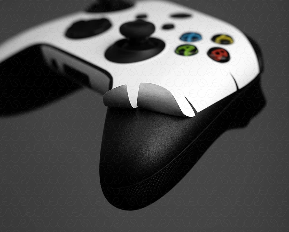 Close-up of a gaming controller with a white face design on a dark background